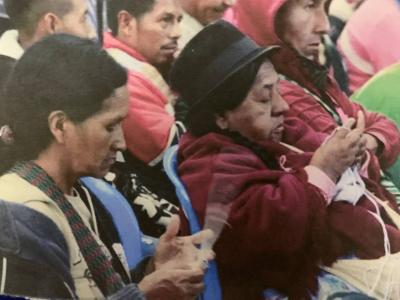 Women weaving together image linking to Women weaving paths of resistance across fenced lands and restricted skies in Colombia